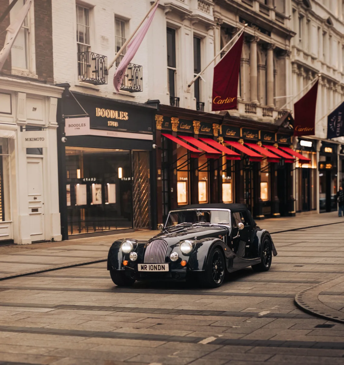 Morgan car on Bond Street at dusk
